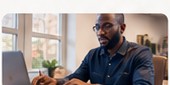 Business founder working at a laptop